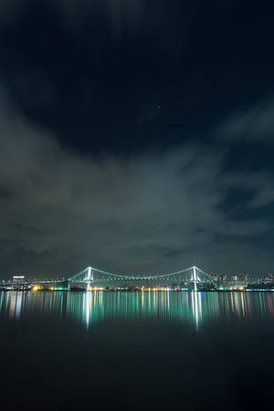 The Iconic Rainbow Bridge In Tokyo, Japan Wallpaper