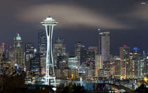 The Iconic Seattle Skyline At Sunset Wallpaper