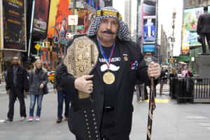 The Iron Sheik Holding Belt Wallpaper