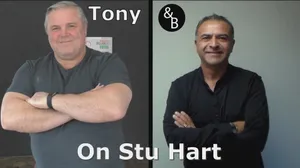 The Legendary Stu Hart Posing In His Wrestling Gym Wallpaper