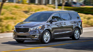 The Luxurious 2023 Kia Sedona Cruising In Style Wallpaper