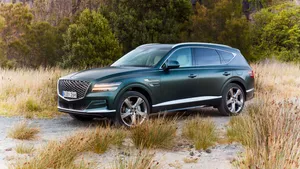 The Luxurious Genesis Gv80 Suv In A Majestic Scenic Nature Wallpaper