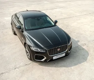 The Luxurious Jaguar Xf On Road Wallpaper