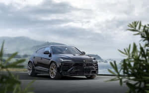 The Luxurious Lamborghini Urus Suv In Action Wallpaper