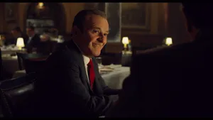 The Main Characters From The Irishman In Intense Conversation Wallpaper