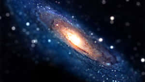 The Majestic Andromeda Galaxy Looms In The Night Sky. Wallpaper