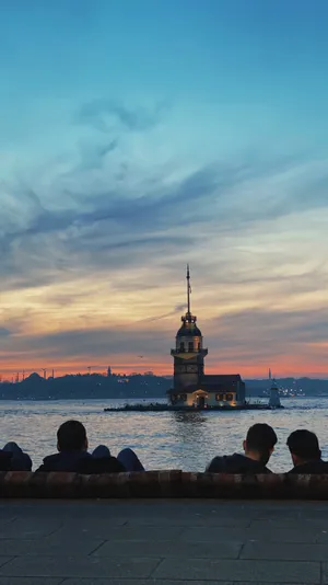 The Majestic Maiden Tower Against An Azure Sky Wallpaper