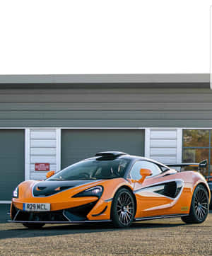 The Mclaren 620r Posing On The Race Track Wallpaper