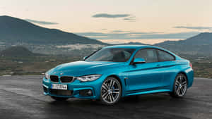 The New Bmw 4 Series Coupe Is Shown In Blue Wallpaper