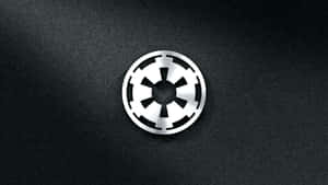 The Official Logo Of The Galactic Empire From The Original Star Wars Trilogy Wallpaper