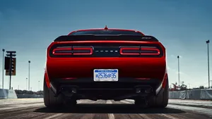 The Rear End Of A Red Dodge Challenger Wallpaper