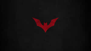 The Red Batman Logo Standing Tall Wallpaper