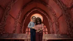 The Shivering Truth Man Holding Woman Wallpaper