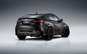 The Sleek And Powerful Bmw X6 In Action Wallpaper