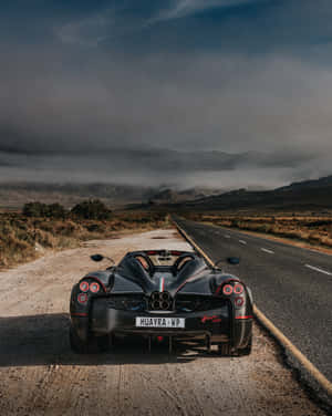 The Sleek And Powerful Pagani Huayra Roadster Bc In Action Wallpaper