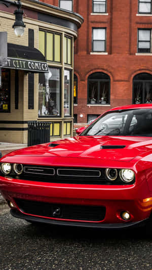 The Sleek And Stylish Look Of A Red Car In An Iphone Wallpaper