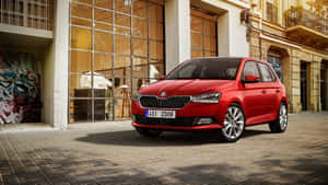 The Sleek And Stylish Skoda Fabia In Vibrant Red Wallpaper