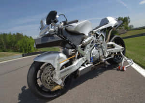 The Sleek Vyrus Motorcycle, Epitome Of Speed And Elegance Wallpaper