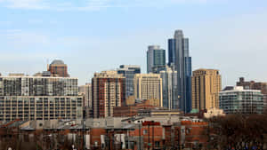 The Spectacular Skyline Of Chicago Illuminated At Dusk Wallpaper