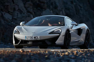 The Splendid Mclaren 570gt In Dynamic Motion Wallpaper
