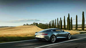 The Stunning Aston Martin Db9 In Elegant Motion Wallpaper