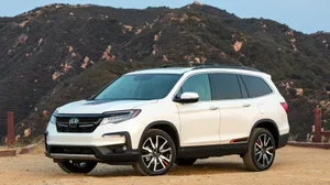 The Stunning Honda Pilot Cruising On The Open Road Wallpaper