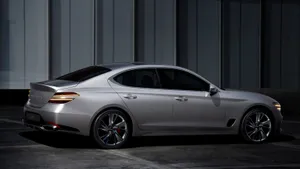 The Stylish And Powerful Genesis G70 Luxury Sedan In Action Wallpaper