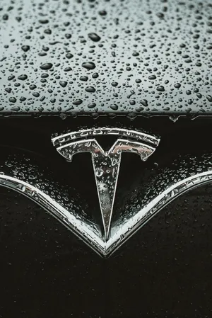 The Tesla Logo In 4k Resolution Wallpaper