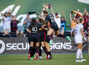 The Thunderous Portland Thorns Fc In Action Wallpaper