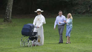 The Young Pope Strollingwith Baby Carriage Wallpaper