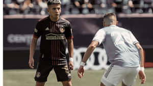 Thiago Almada Playing Against Joseph Mora Wallpaper