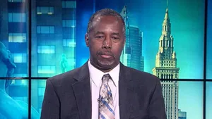 Thoughtful Ben Carson Attentively Listening Wallpaper