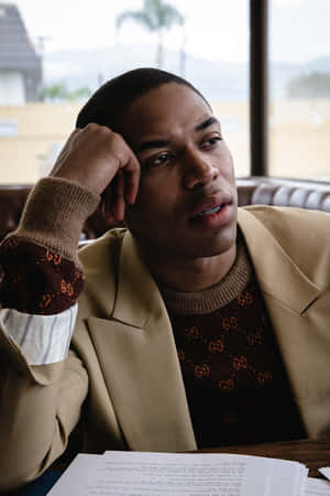 Thoughtful Manin Cafewith Script Wallpaper