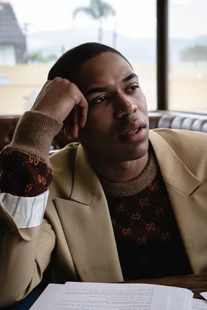 Thoughtful Manin Cafewith Script Wallpaper