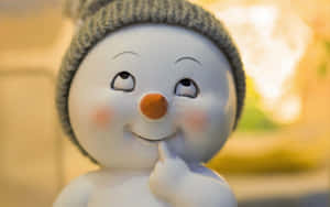 Thoughtful Snowman Figurine Wallpaper