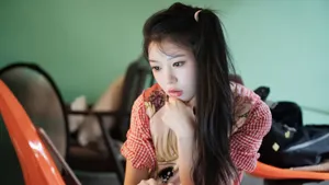 Thoughtful Young Woman Indoors Wallpaper