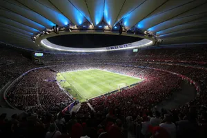 Thousands Of Fans Welcoming Their Home Team In A Vibrant Soccer Stadium Wallpaper
