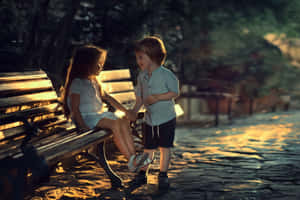 Three Adorable Children Playing Together Outdoors Wallpaper