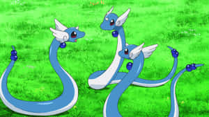 Three Dragonair Pokemon On Grass Wallpaper