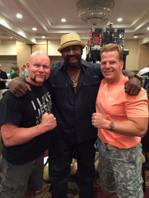 Three Men Posingat Event Wallpaper