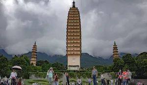 Three Pagodas Filled With Tourists Wallpaper