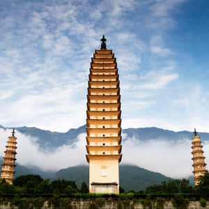 Three Pagodas With Wispy Clouds Wallpaper