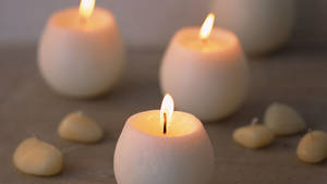 Three White Candles Wallpaper