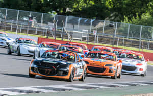 Thrilling Car Racing Action Wallpaper