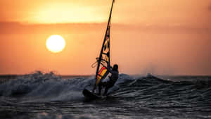 Thrilling Jet Ski Ride At Sunset Wallpaper