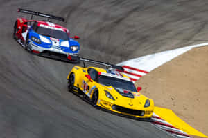 Thrilling Speed At The Racetrack Wallpaper