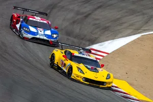 Thrilling Speed At The Racetrack Wallpaper