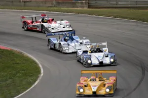 Thrilling Speed At The Racetrack Wallpaper