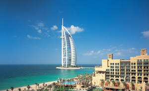 Thrilling View Of The Burj Al Arab Mesmerizing The Dubai Cityscape Wallpaper