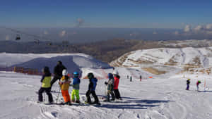 Thrilling Winter Adventure - Man Snowboarding On A Picturesque Downhill Slope Wallpaper